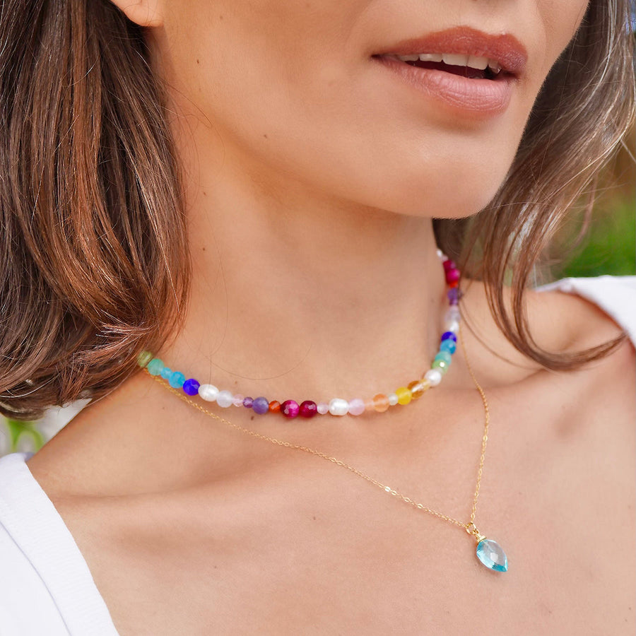 Multi-colored gemstone choker necklace, festive and vibrant, featuring 18K gold-plated silver chain, perfect for summer styling.
